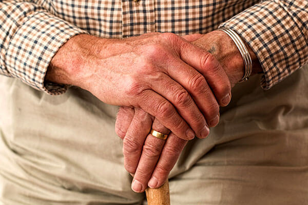 Elderly person's hands folded